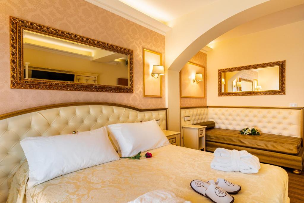 Postel nebo postele na pokoji v ubytování Hotel Mazzanti