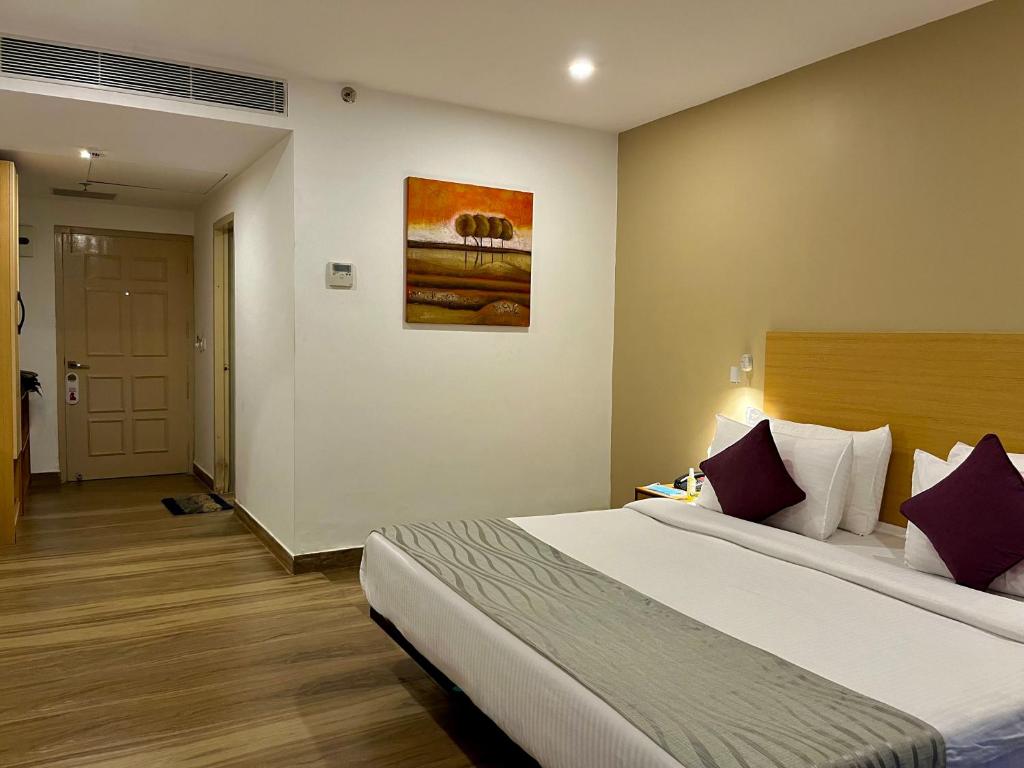 Postel nebo postele na pokoji v ubytování Hotel The Golden Sands
