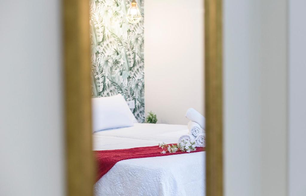 Posteľ alebo postele v izbe v ubytovaní LaLa Suites Corredera Centro