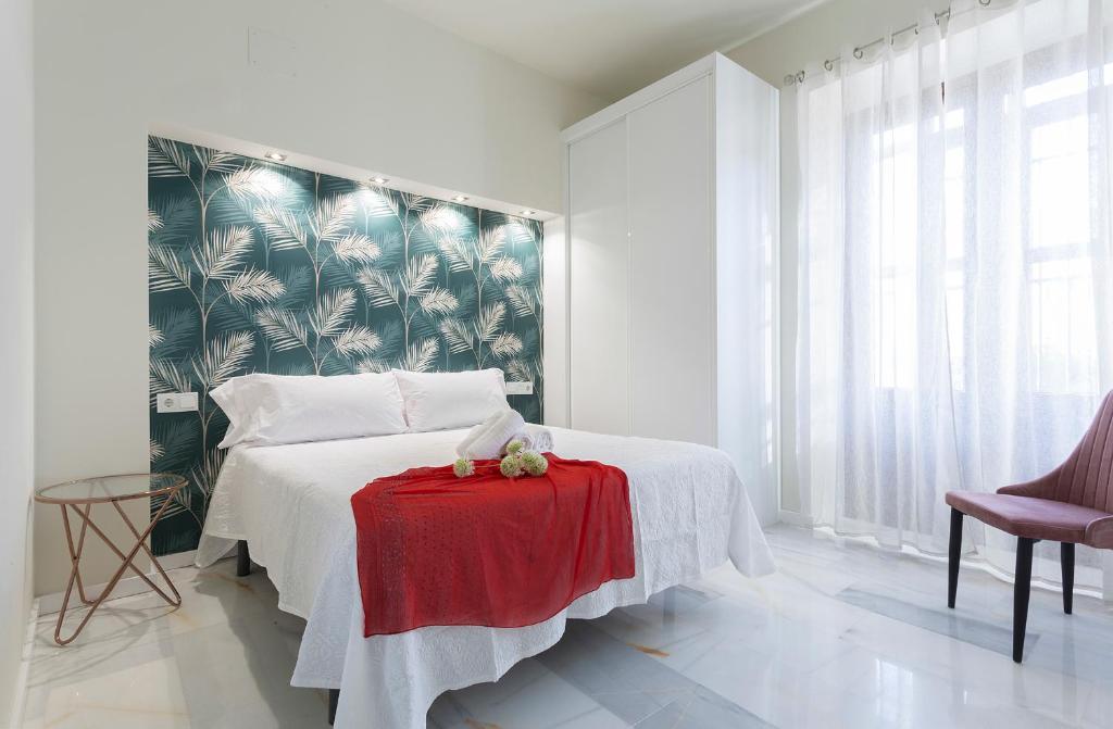 Posteľ alebo postele v izbe v ubytovaní LaLa Suites Corredera Centro