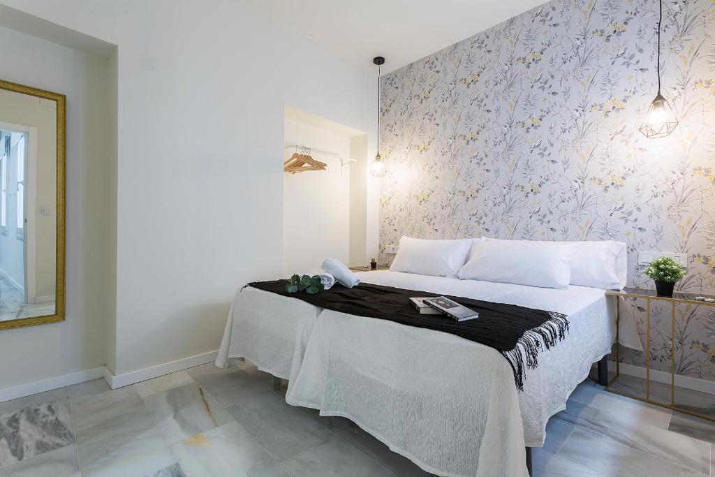 Posteľ alebo postele v izbe v ubytovaní LaLa Suites Corredera Centro