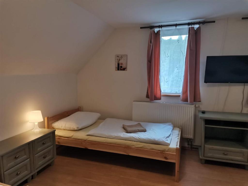 Postel nebo postele na pokoji v ubytování Sedlonov 178