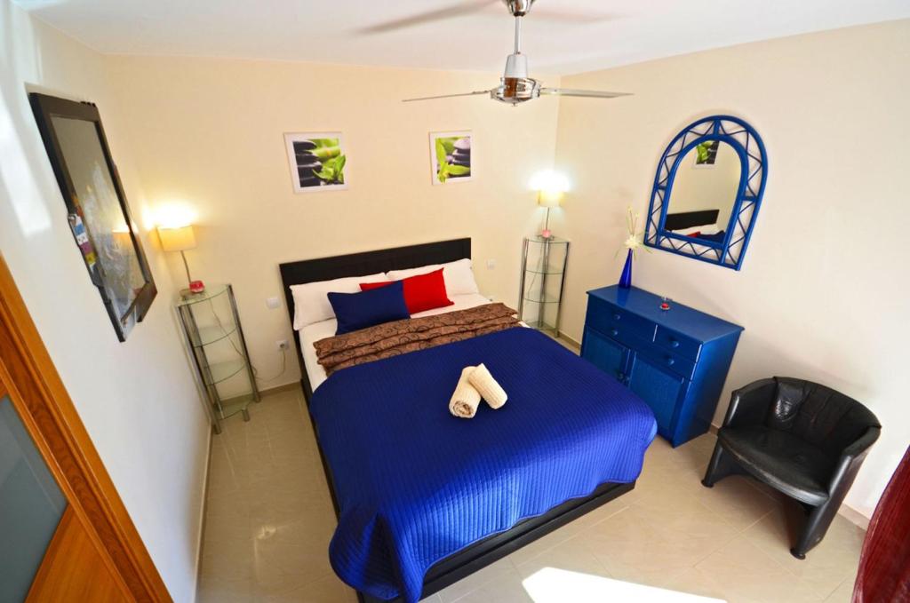 A bed or beds in a room at Ferienwohnung PLAYA - Pool - 50 m Strand - Meerblick - WiFi