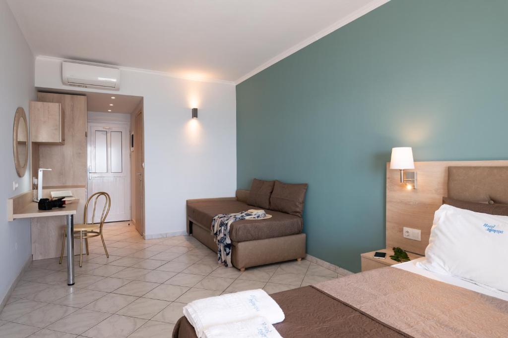 Postel nebo postele na pokoji v ubytování Hotel Dimitra