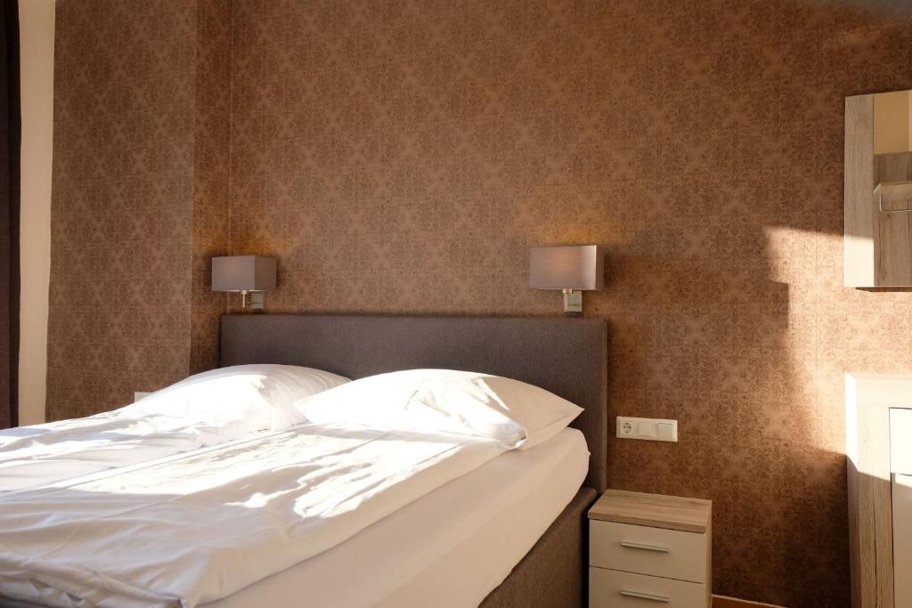 Postel nebo postele na pokoji v ubytování Zum Weissen Lamm