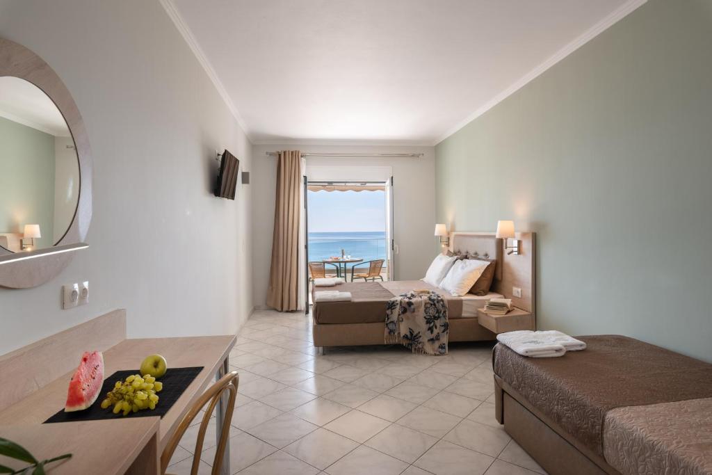 Postel nebo postele na pokoji v ubytování Hotel Dimitra