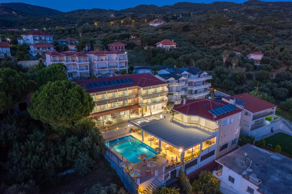 an aerial view of a mansion with a swimming pool at Hotel Dimitra in Ligia