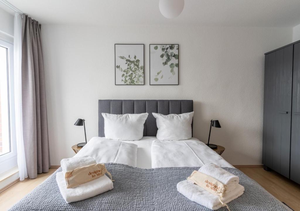 Postel nebo postele na pokoji v ubytování limehome Magdeburg Breiter Weg