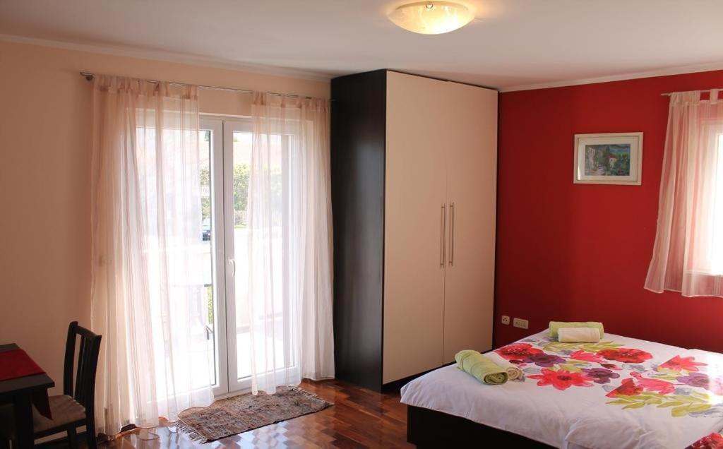 Posteľ alebo postele v izbe v ubytovaní Apartments Logos