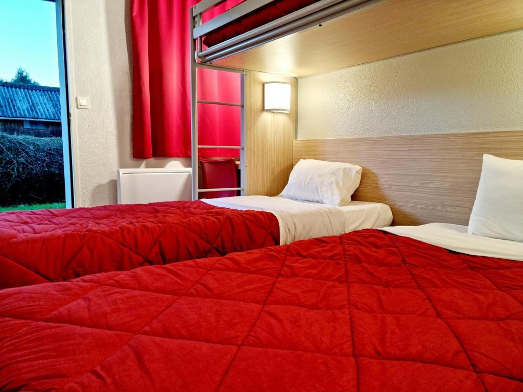 Postel nebo postele na pokoji v ubytování Premiere Classe Honfleur
