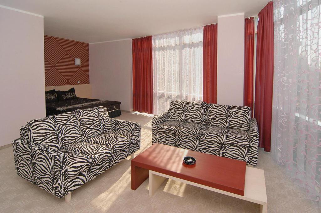Postel nebo postele na pokoji v ubytování Hotel Noris