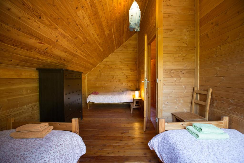 Postel nebo postele na pokoji v ubytování Le Bois de Faral