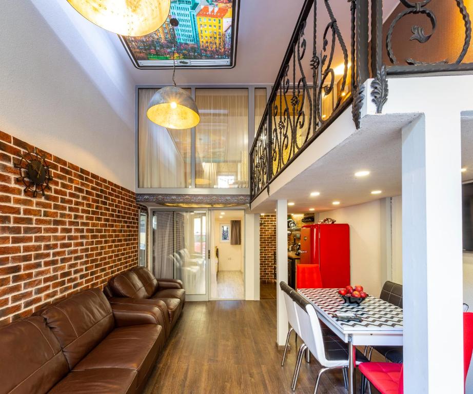 a living room with a couch and a table at Top Center Vintage Sofia Condo in Sofia