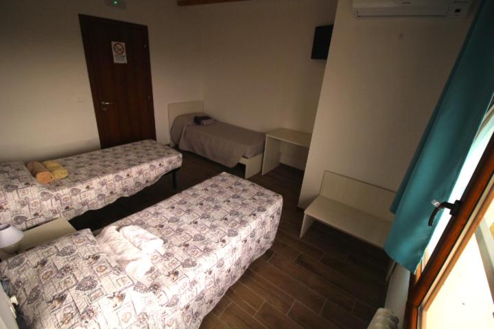 Letto o letti in una camera di B&B Ca' Bianca