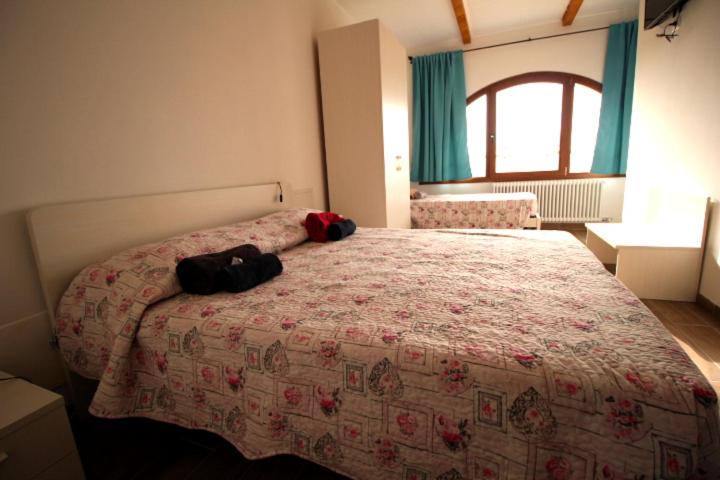 Letto o letti in una camera di B&B Ca' Bianca