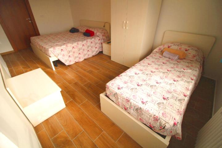 Letto o letti in una camera di B&B Ca' Bianca