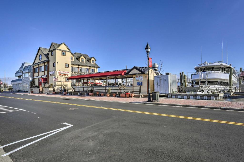 an empty street in front of a building with a boat at Freeport Guesthouse - Walk to Nautical Mile! in Freeport