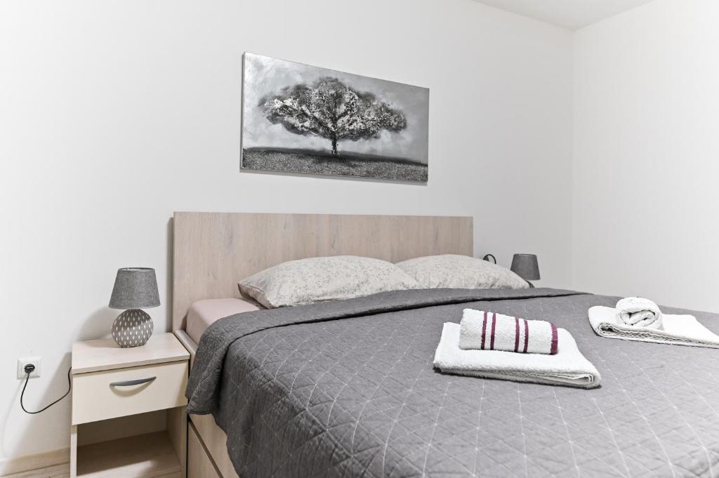 Posteľ alebo postele v izbe v ubytovaní Apartment DS