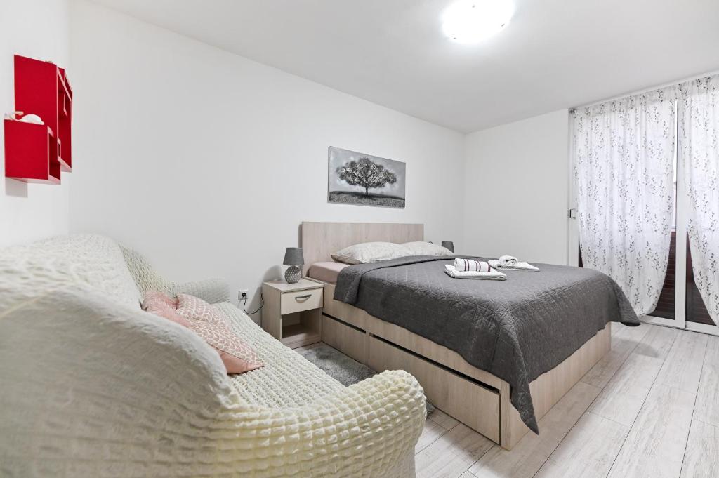 Posteľ alebo postele v izbe v ubytovaní Apartment DS