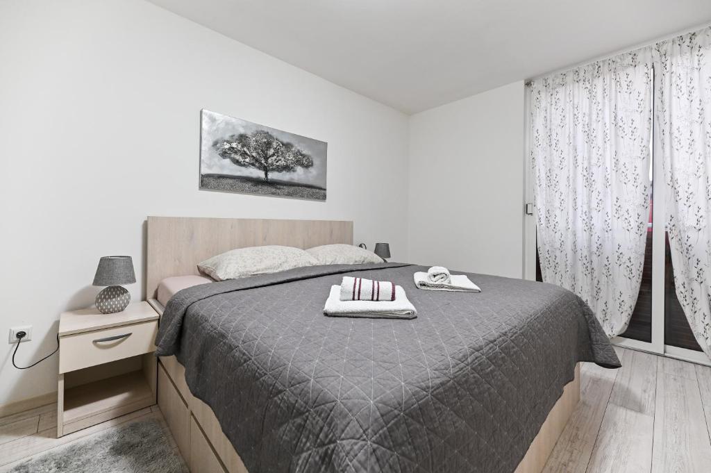 Posteľ alebo postele v izbe v ubytovaní Apartment DS