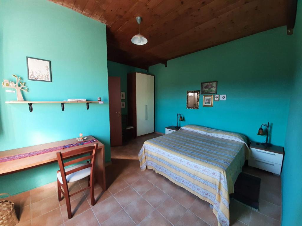 Postel nebo postele na pokoji v ubytování Tenuta Le Tre Querce