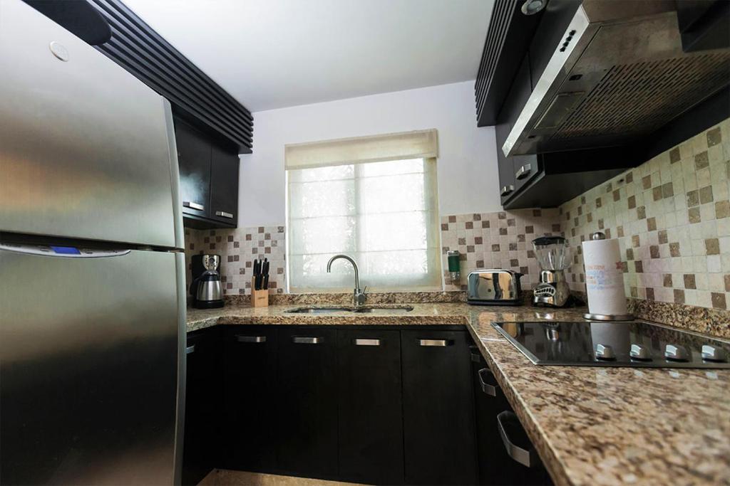 Una cocina o zona de cocina en Zafiro Beach Boutique Resort