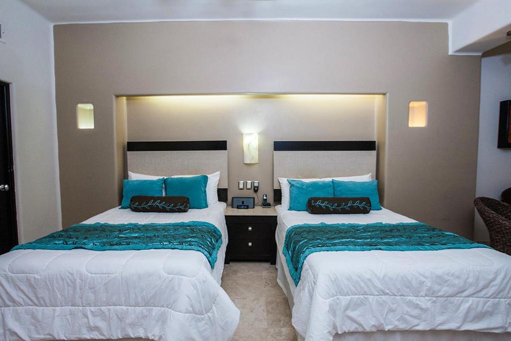 Cama o camas de una habitación en Zafiro Beach Boutique Resort