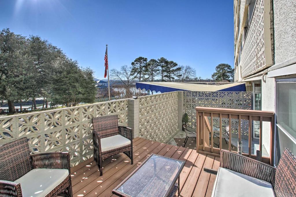 a patio with chairs and a table on a deck at Stunning Hot Springs Condo on Lake Hamilton! in Hot Springs