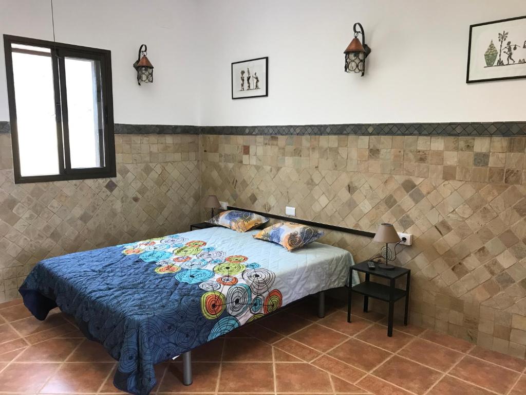 A bed or beds in a room at casaenos