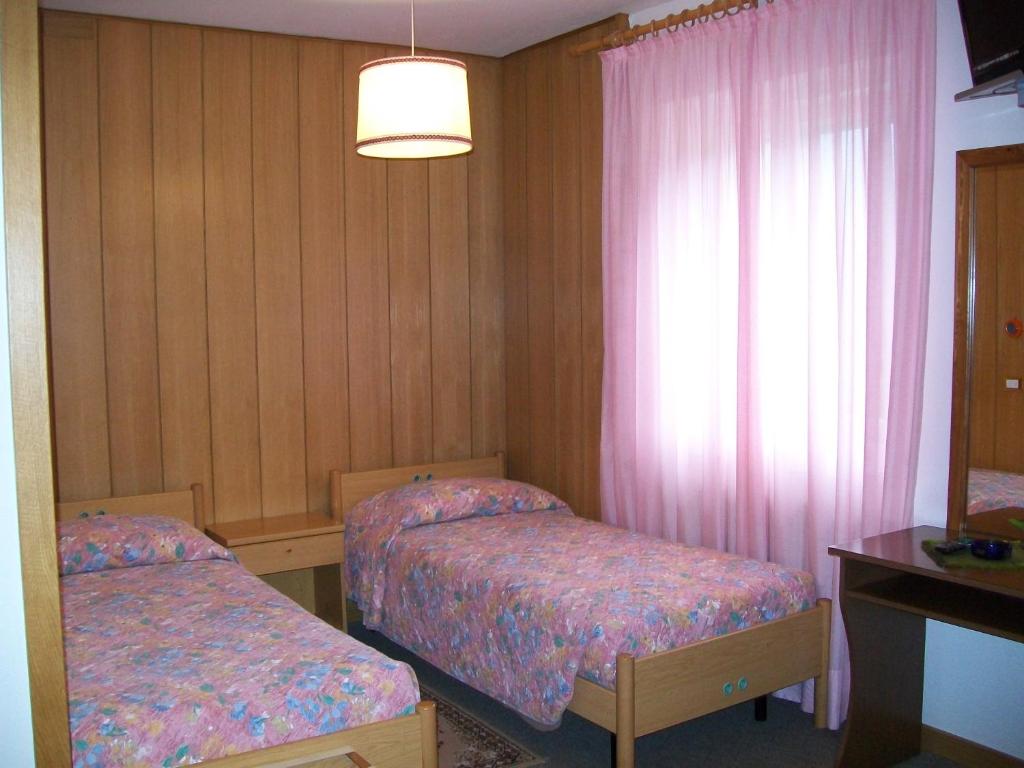 Postel nebo postele na pokoji v ubytování Albergo Bellavista