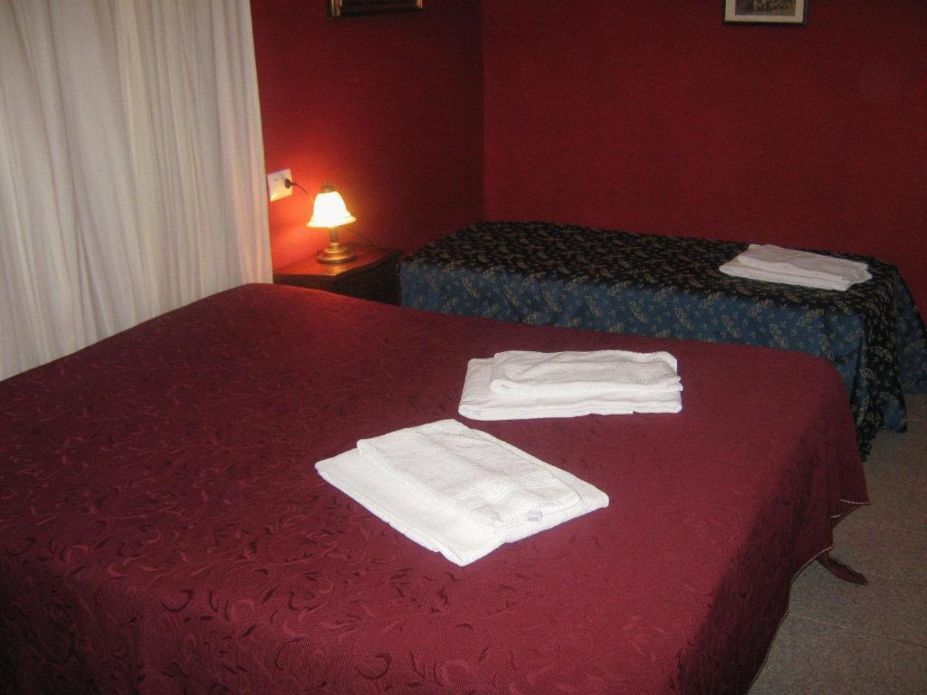 Postel nebo postele na pokoji v ubytování Hotel Ferraro