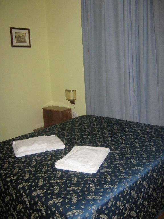 Postel nebo postele na pokoji v ubytování Hotel Ferraro