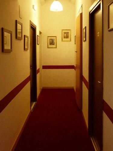 Postel nebo postele na pokoji v ubytování Hotel Ferraro