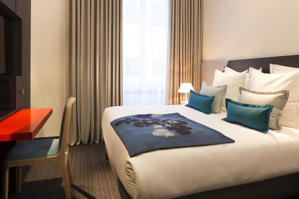 Postel nebo postele na pokoji v ubytování Hotel D - Strasbourg