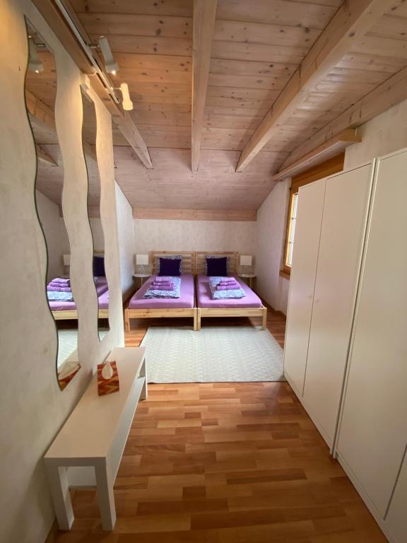 Postel nebo postele na pokoji v ubytování Haus Wiggis
