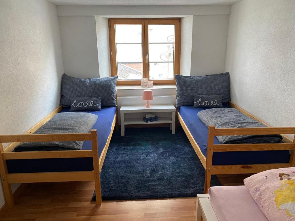 Postel nebo postele na pokoji v ubytování Haus Wiggis