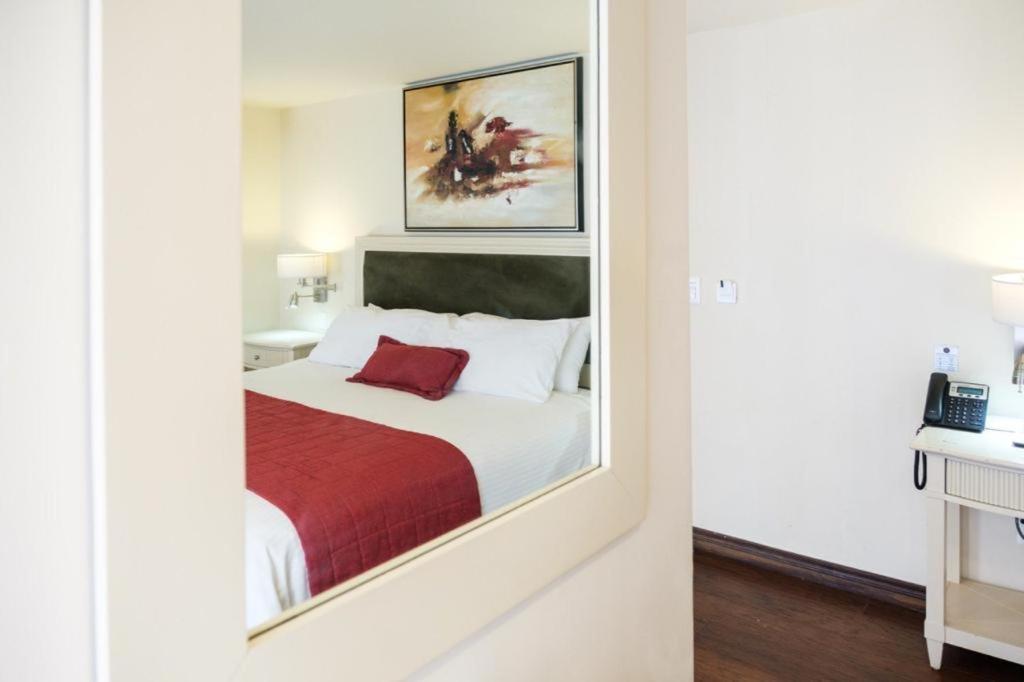 Postel nebo postele na pokoji v ubytování Isabella Boutique Hotel
