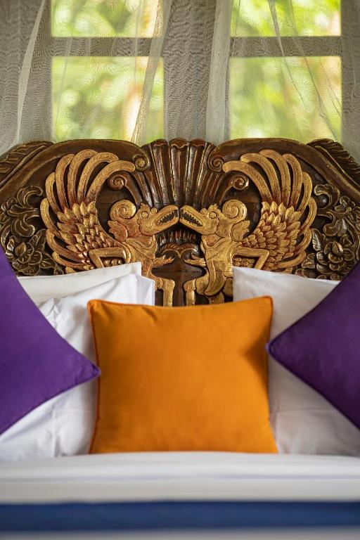 Postel nebo postele na pokoji v ubytování Alam Jiwa Ubud