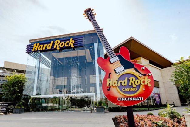 a guitar sign in front of a hard rock building at Modern Rustic split level with balcony in Cincinnati