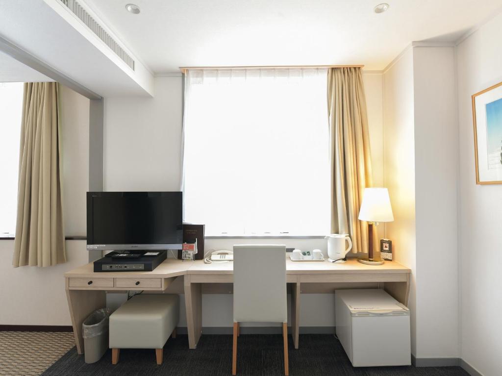 TV a/nebo společenská místnost v ubytování Hotel Iidaya