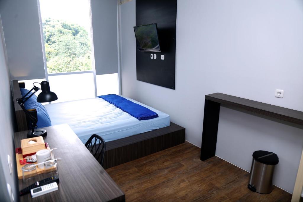 Postel nebo postele na pokoji v ubytování My Dormy Hostel UMM