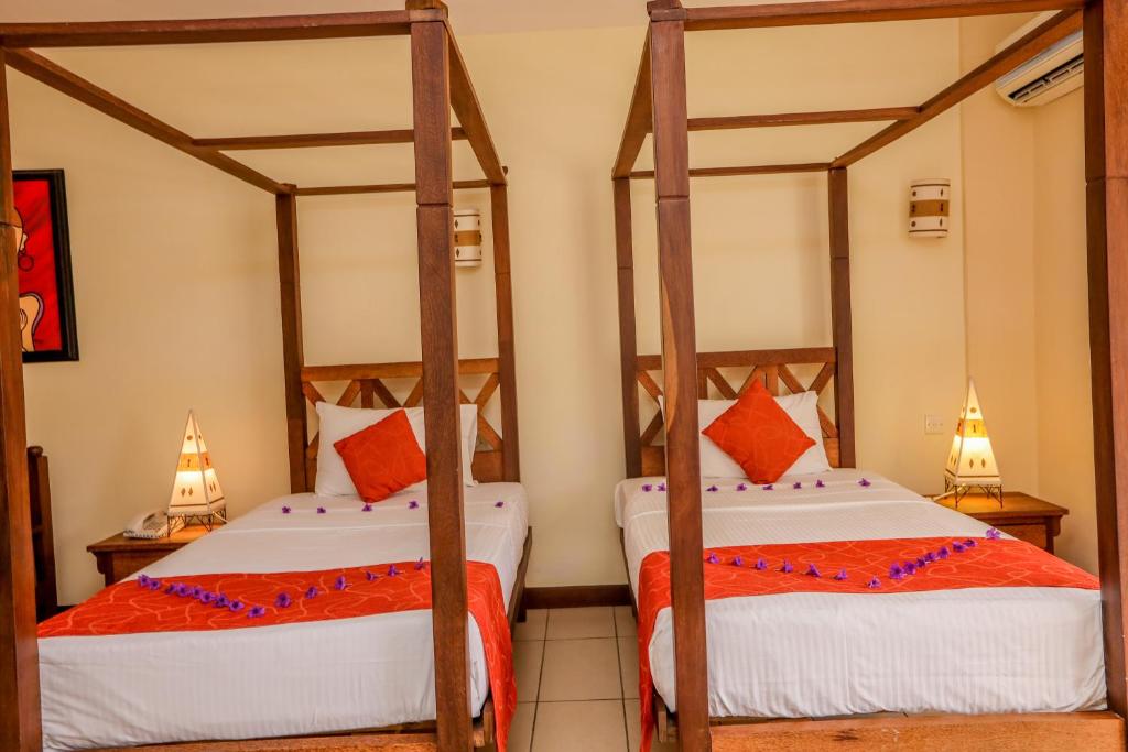 Postel nebo postele na pokoji v ubytování CityBlue Creekside Hotel & Suites