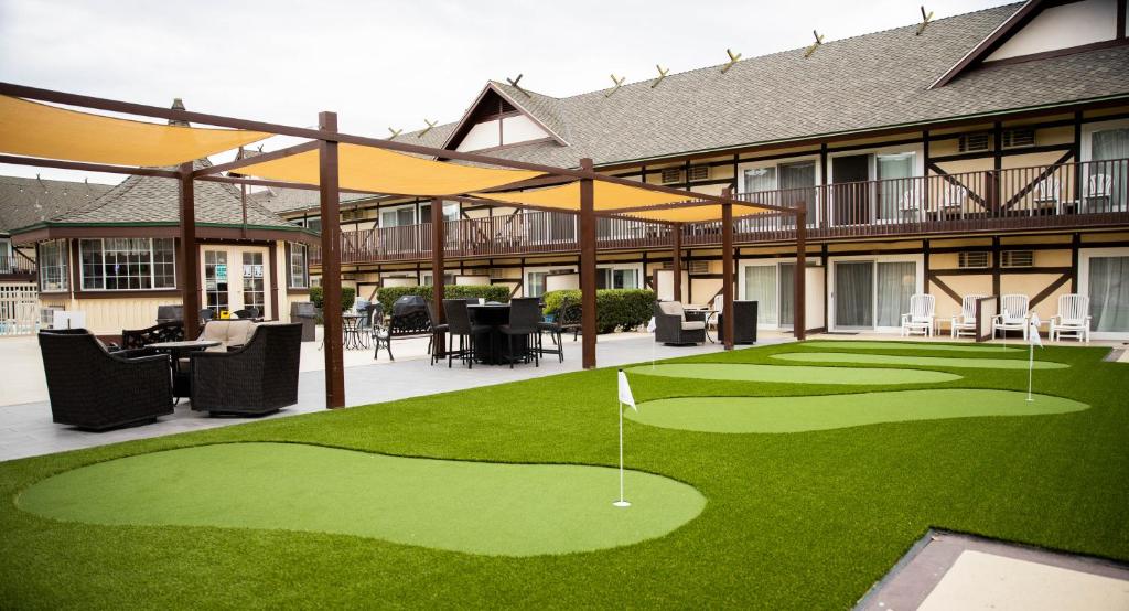 a golf course in front of a building with a green at Pea Soup Andersen's Inn in Buellton