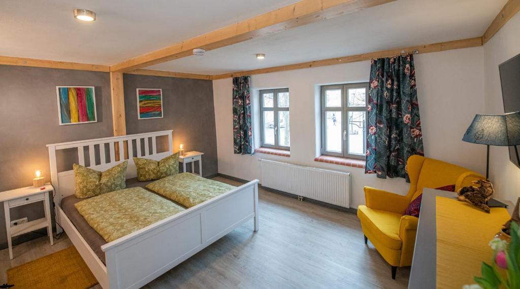 Postel nebo postele na pokoji v ubytování Gästehaus am Stadttor