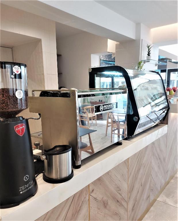 Kuchyň nebo kuchyňský kout v ubytování Roseum Boutique Hotel