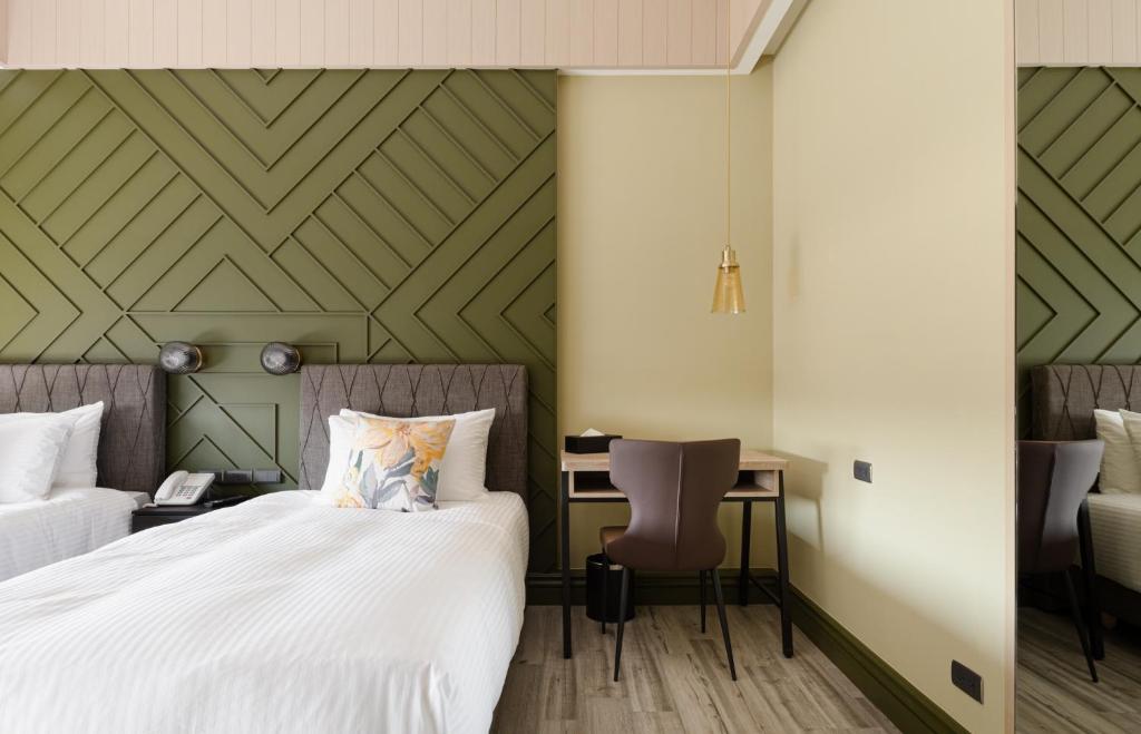 Postel nebo postele na pokoji v ubytování 森行旅 Mori Hotel -台南安平老街