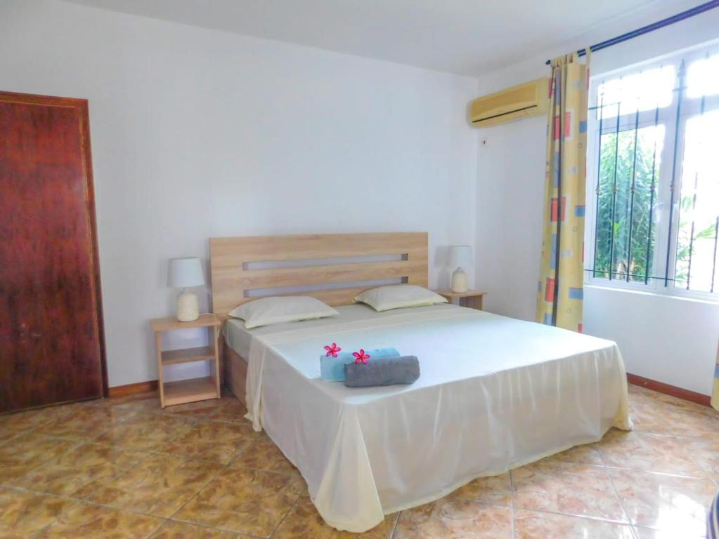 Postel nebo postele na pokoji v ubytování Tulsi Apartment & Studio
