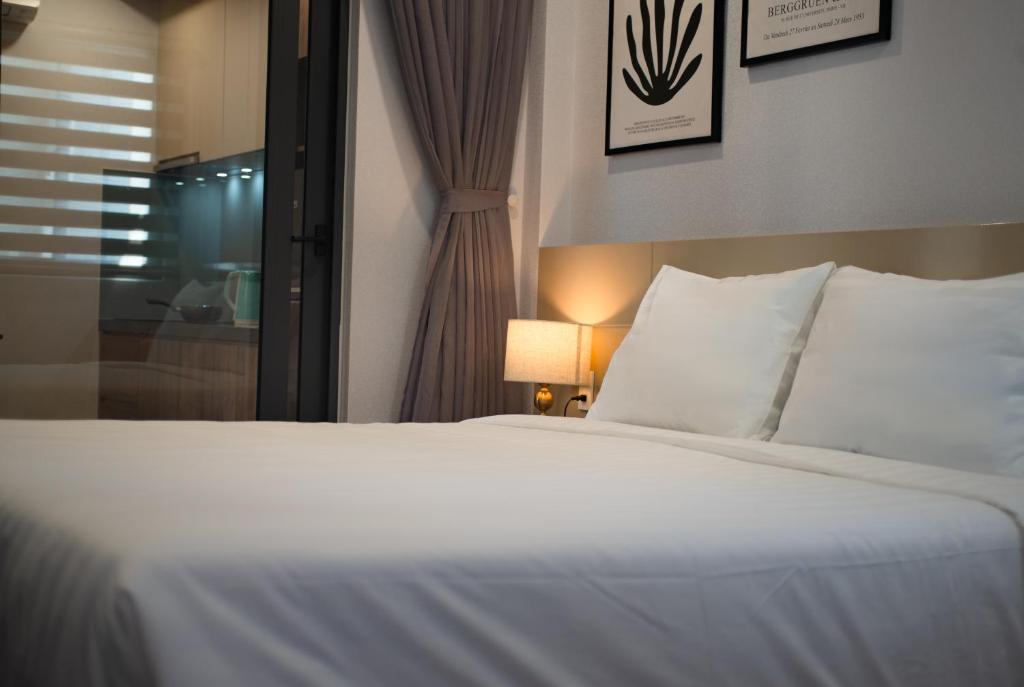 Postel nebo postele na pokoji v ubytování The Anchor Apartment - Nha Trang