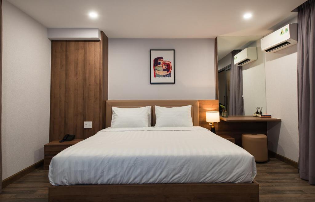 Postel nebo postele na pokoji v ubytování The Anchor Apartment - Nha Trang