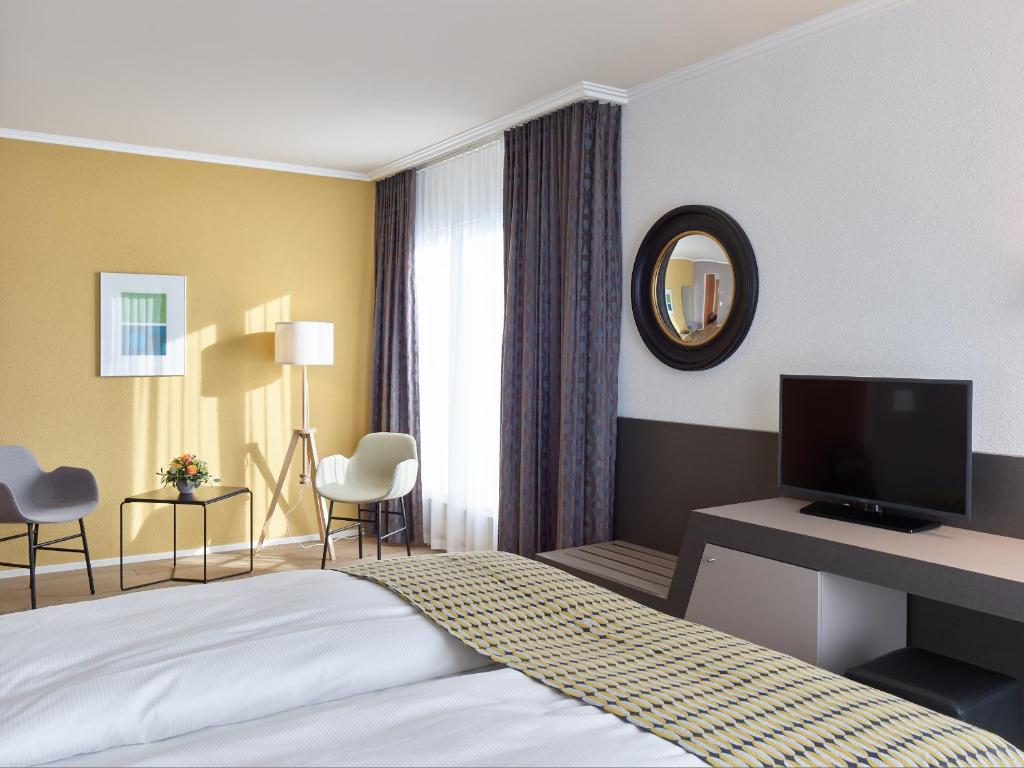 Postel nebo postele na pokoji v ubytování Hotel Berchtold